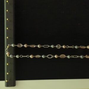 Premier design silver colored necklace with matching earrings